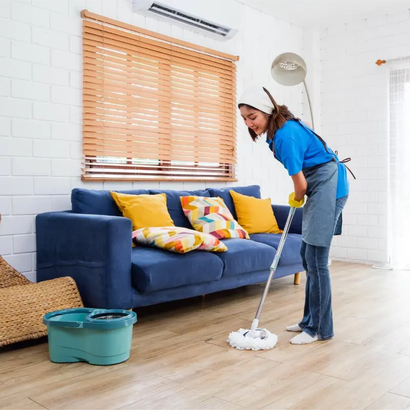 trusted cleaner cleaning the living area during professional cleaning services in Richmond
