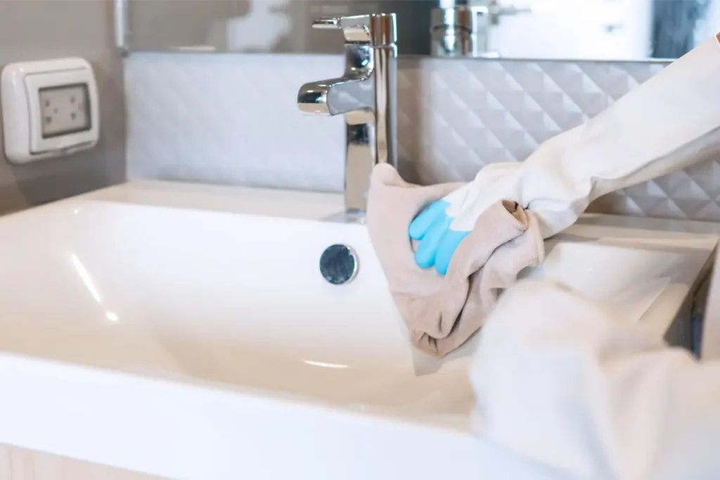 professional cleaner deep cleaning the basin