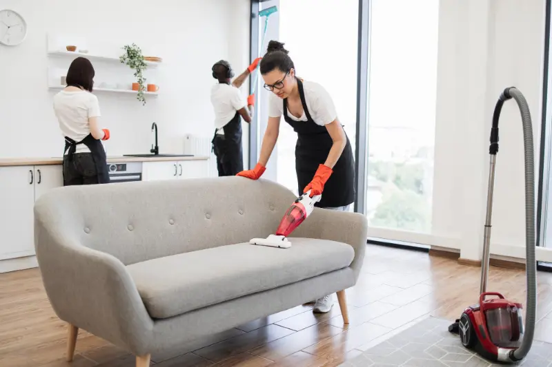 Professional cleaners thoroughly cleaning every corner during condo cleaning