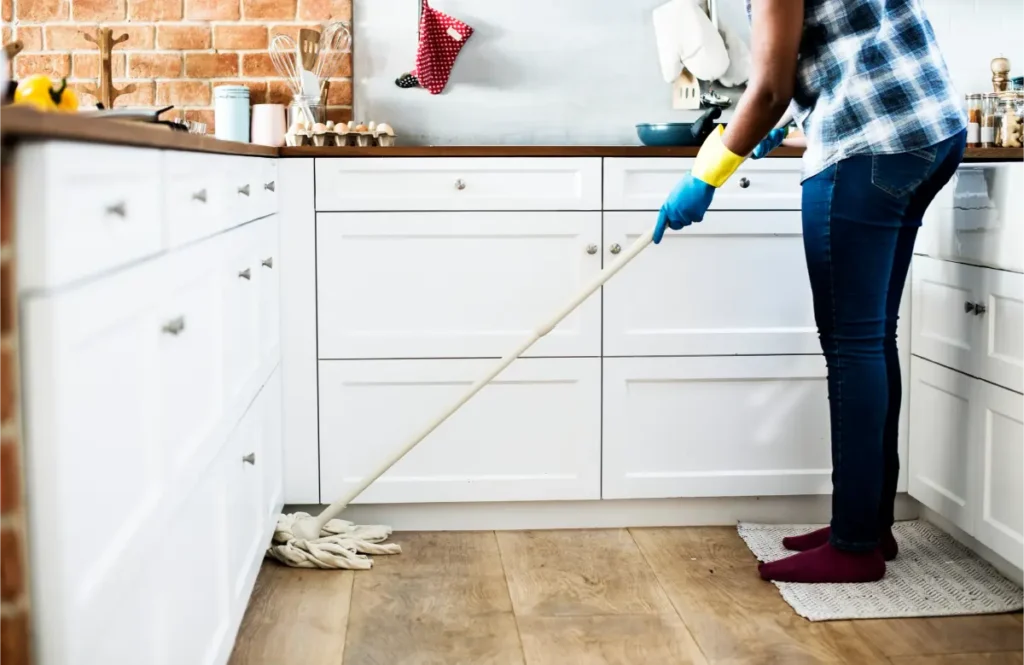 woman mopping the kitchen floor