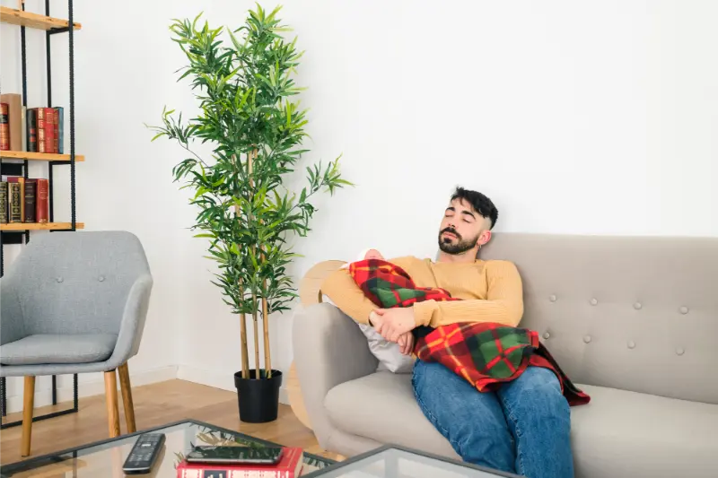 man relaxing at home after spring cleaning