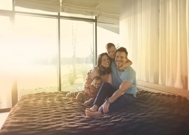 happy family enjoying at the bedroom after thorough professional cleaning services in Maple Ridge