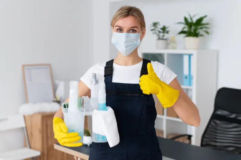 Happy professional cleaner after delivering expert house cleaning services in Toronto