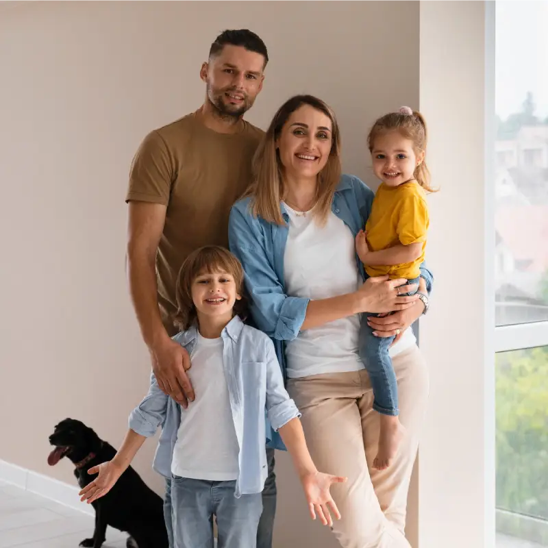 happy family enjoying with kids and pets at Vancouver home after taking professional cleaning services in Vancouver