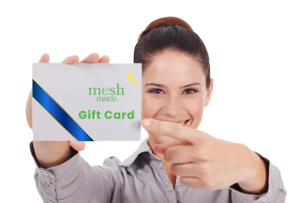 Young female holding Mesh Maids gift card for cleaning services in Richmond