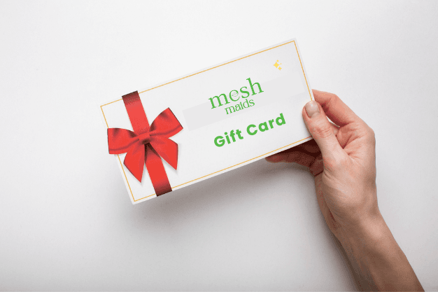 Woman holding Mesh Maids gift card for cleaning services in Markham