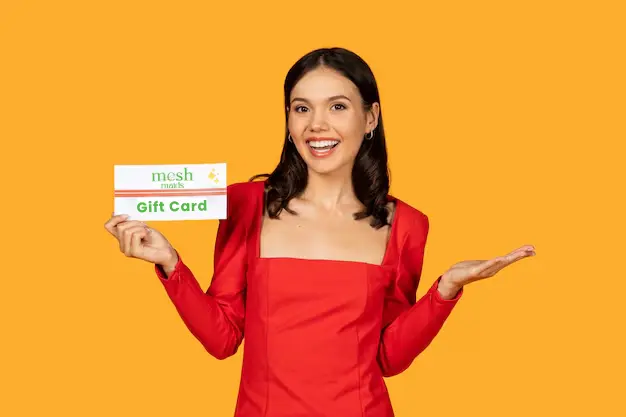 Woman holding Mesh Maids' gift card for cleaning services in Scarborough