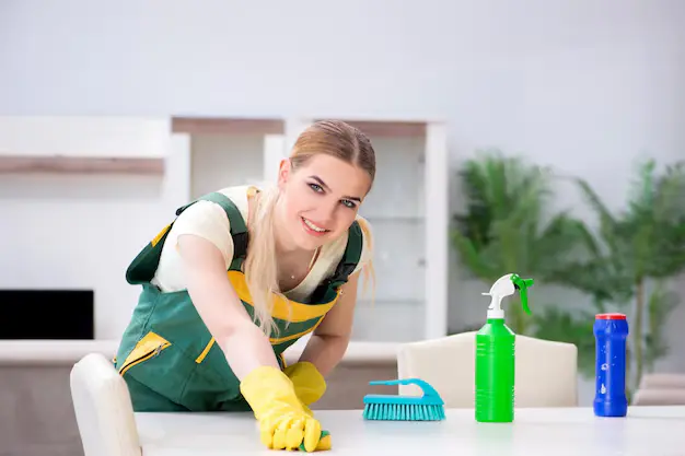 Woman cleaning professional happily cleaning during house cleaning services in Ajax