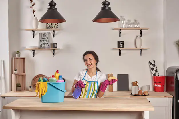 Happy professional cleaner while providing cleaning services in Richmond Hill, ensuring a spotless home