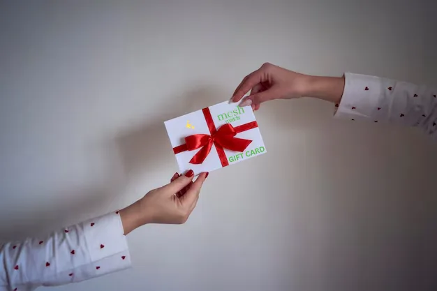 Woman giving Mesh Maids gift card for house cleaning services in Oshawa