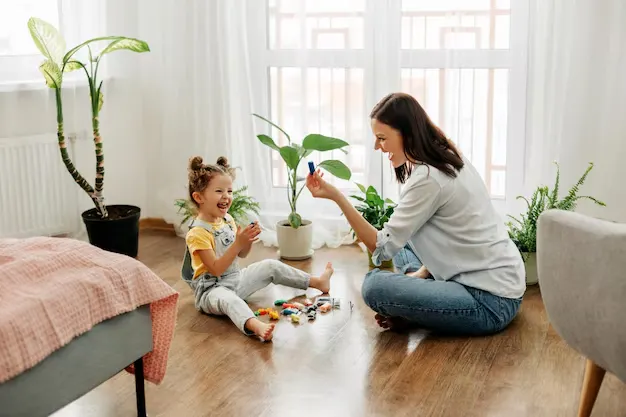 Mother playing with her daughter after eco-friendly cleaning services in Milton