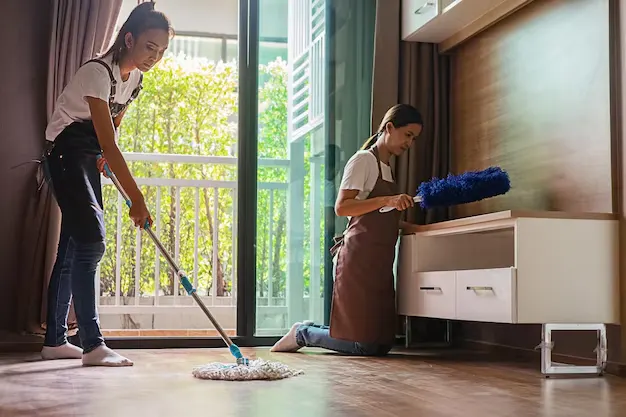 Women cleaning bedroom for deep house cleaning services