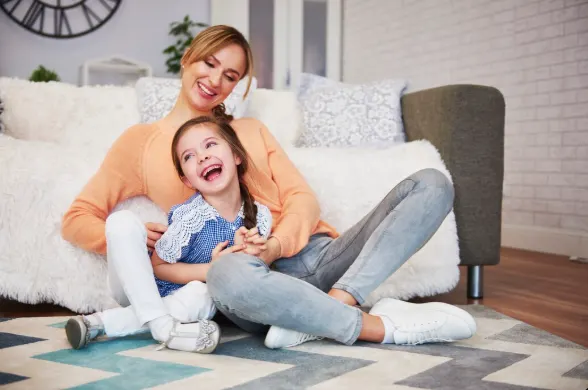Parents and kids enjoying at a clean home after hiring Mesh Maids house cleaning services in Coquitlam, Port Coquitlam & Port Moody